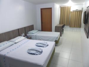 Cama ou camas em um quarto em Hotel CTC