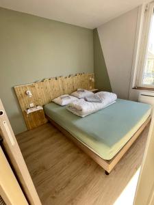Postel nebo postele na pokoji v ubytování Saint-Aubin-Sur-Mer: Bel appartement traversant