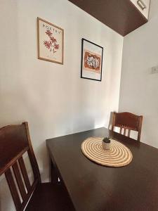 a dining room with a table and two chairs at Cozy, charming one bedroom apt in Podgorica