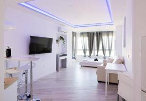 Telewizja i/lub zestaw kina domowego w obiekcie Sun Apartments