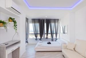 Łóżko lub łóżka w pokoju w obiekcie Sun Apartments