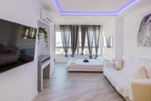 Telewizja i/lub zestaw kina domowego w obiekcie Sun Apartments