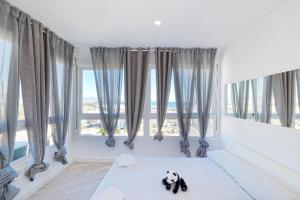 Łóżko lub łóżka w pokoju w obiekcie Sun Apartments