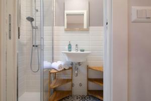 a bathroom with a sink and a shower at AZURE RETREAT Apartment in Camogli +30 photos