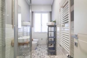 a bathroom with a toilet and a sink at AZURE RETREAT Apartment in Camogli +27 photos