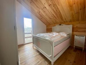 Postel nebo postele na pokoji v ubytování Chalet vue lac