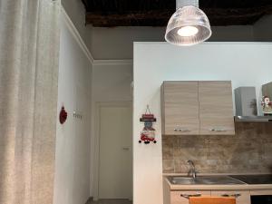 a kitchen with a sink and a counter top at Neapolis francy Vesuvio in Naples