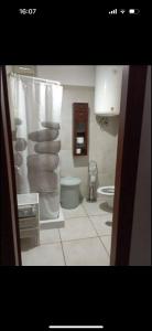 een badkamer met een wastafel en een toilet in een kamer bij DON BOSCO 2 in Bari Palese