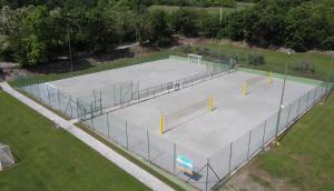 an overhead view of a tennis court in a park at Bran & Denise Residence in Costermano