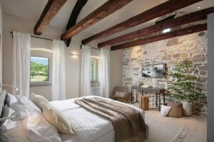 Postel nebo postele na pokoji v ubytování Villa Baracchi