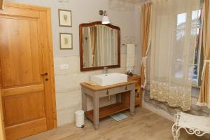 a bathroom with a sink and a mirror at Casa Pini Rio_B in Riolunato