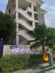 a large apartment building with a sign in front of it at Condotel Minimalist in Marilao