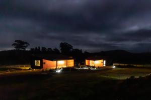 a house lit up at night with lights at Wherewithal Luxury Suites in Carlton