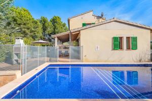 a villa with a swimming pool and a house at Villa Manresa in Alcudia by JS Villas in Alcudia
