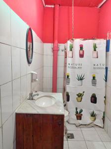 a bathroom with a sink and a toilet with potted plants at Origenes in Santiago