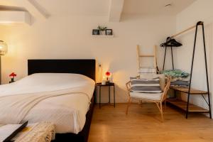 Ein Bett oder Betten in einem Zimmer der Unterkunft Madrid Suites