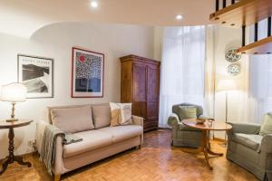 a living room with a couch and two chairs and a table at XXseptemberHome in Rome