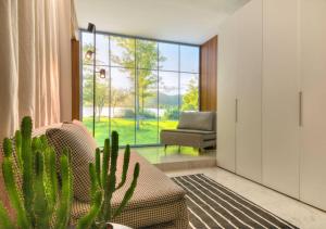 a living room with a couch and a cactus at Livin'Milano PRESTIGE in Milan