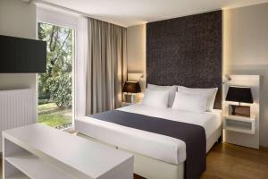 Łóżko lub łóżka w pokoju w obiekcie Amedia Luxury Suites Graz, Trademark Collection by Wyndham