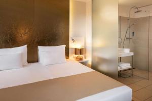 Łóżko lub łóżka w pokoju w obiekcie Amedia Luxury Suites Graz, Trademark Collection by Wyndham