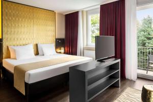 Łóżko lub łóżka w pokoju w obiekcie Amedia Luxury Suites Graz, Trademark Collection by Wyndham