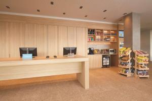 a cashier counter in a store with a cash register at Hilton Garden Inn Busselton in Busselton