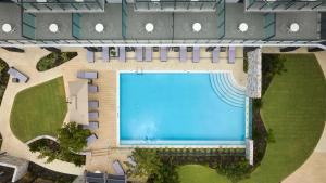 an overhead view of a swimming pool in a building at Hilton Garden Inn Busselton in Busselton