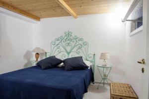 מיטה או מיטות בחדר ב-Donna Sara Appartamento in corte Amalfitana