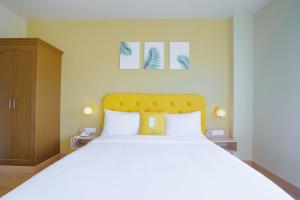 Postel nebo postele na pokoji v ubytování Bloom Hotel - GK2