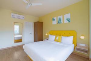 Postel nebo postele na pokoji v ubytování Bloom Hotel - GK2