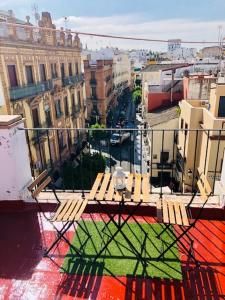a bench sitting on top of a building at Ático, Studio 300 meters from Cathedral and Giralda in Seville