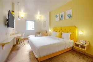 Postel nebo postele na pokoji v ubytování Bloom Hotel - GK2