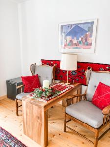 a living room with a couch with red pillows at Istebna 401 MURY in Istebna