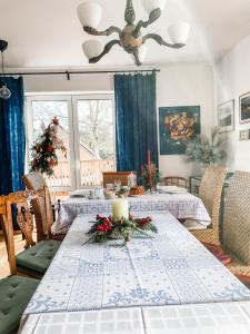 a dining room with a table and a christmas tree at Istebna 401 MURY in Istebna