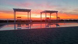 The sunrise or sunset as seen from a panziókat or nearby