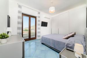 Ένα ή περισσότερα κρεβάτια σε δωμάτιο στο Casa Matilde - Sea View Experience