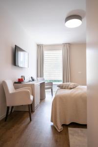 TV a/nebo společenská místnost v ubytování Hotel Magdalena