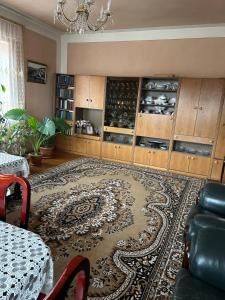 a living room with a rug on the floor at Apartment in Tsaghkadzor