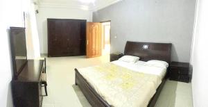 a bedroom with a large bed in a room at La Villa Maria in Dakar