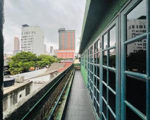 a view of a city from a window of a building at I Villa in in Kuala Lumpur