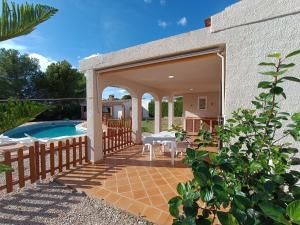 an external view of a house with a swimming pool at VILLA REPOSO in Calafat