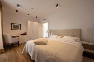 Postel nebo postele na pokoji v ubytování Hotel Magdalena