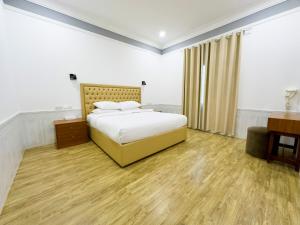 Postel nebo postele na pokoji v ubytování Royal Residence Hotel Apartments