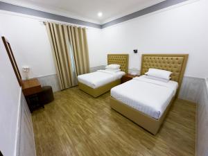 Postel nebo postele na pokoji v ubytování Royal Residence Hotel Apartments