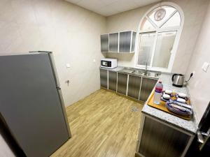 Kuchyň nebo kuchyňský kout v ubytování Royal Residence Hotel Apartments