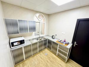 Kuchyň nebo kuchyňský kout v ubytování Royal Residence Hotel Apartments