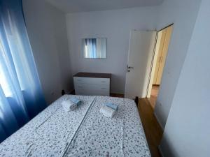 Postel nebo postele na pokoji v ubytování Apartments G&G