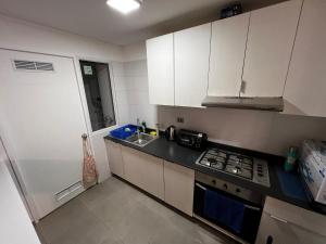 Кухня или мини-кухня в Departamento hasta 6 personas en Quintero
