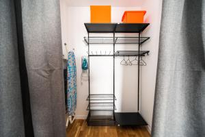 a room with three tiers of shelves at Sarajevo Tower 24th floor apartment in Sarajevo