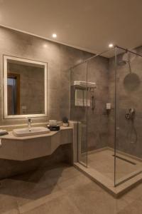 a bathroom with a sink and a shower at Tolip Resort Sunrays New- Alamein in El Alamein